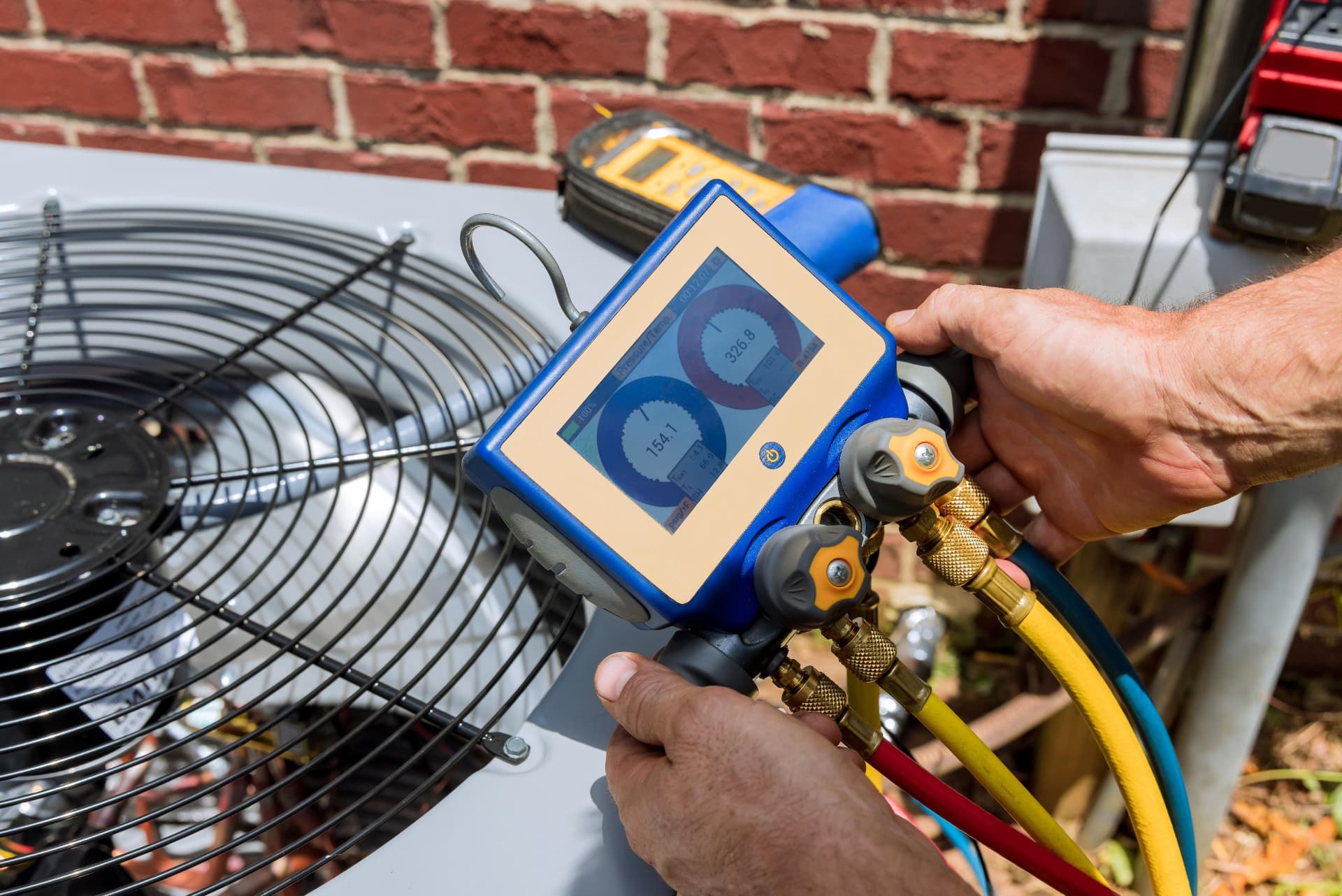 HVAC technician diagnosing an air conditioning system